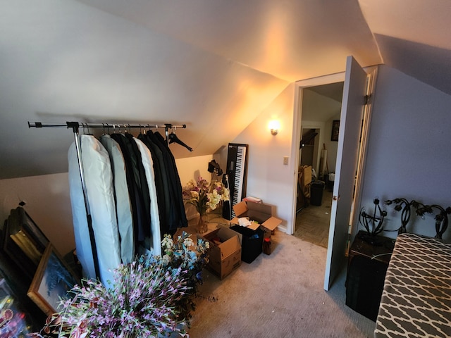 interior space with carpet flooring and vaulted ceiling