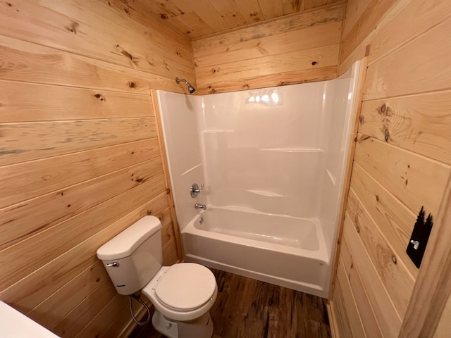 bathroom with bathing tub / shower combination, wood ceiling, and wood walls