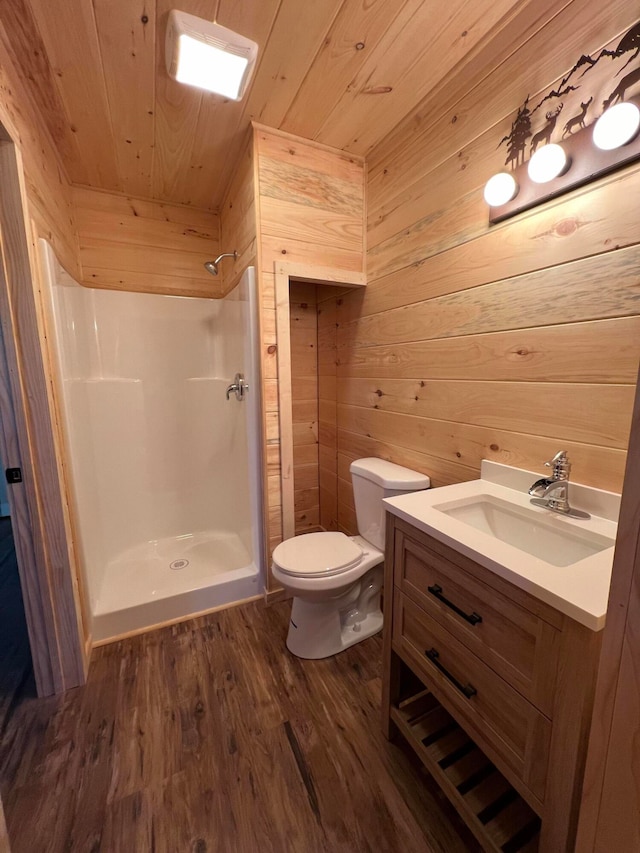 bathroom featuring vanity, toilet, walk in shower, wood-type flooring, and wood ceiling