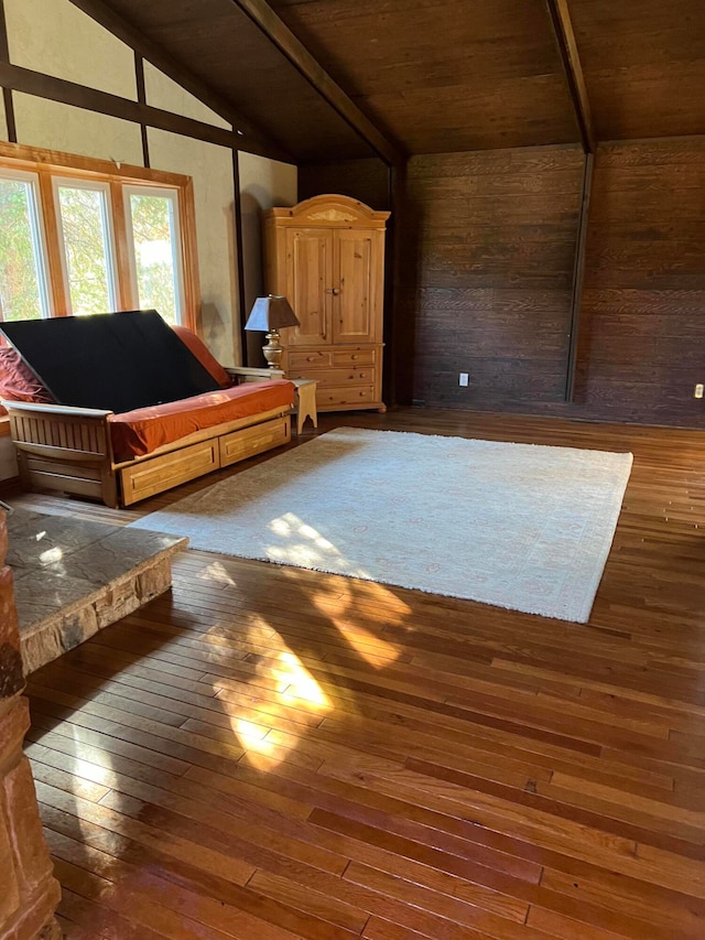 interior space featuring wooden ceiling, dark hardwood / wood-style floors, and lofted ceiling