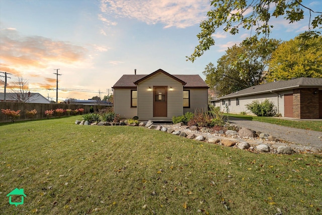 view of front of home with a yard