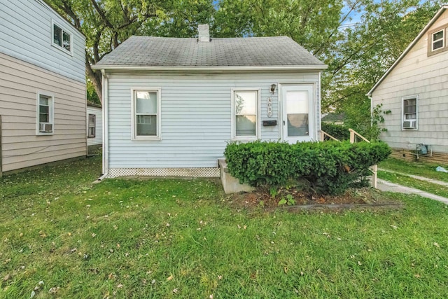 view of home's exterior featuring a yard and cooling unit