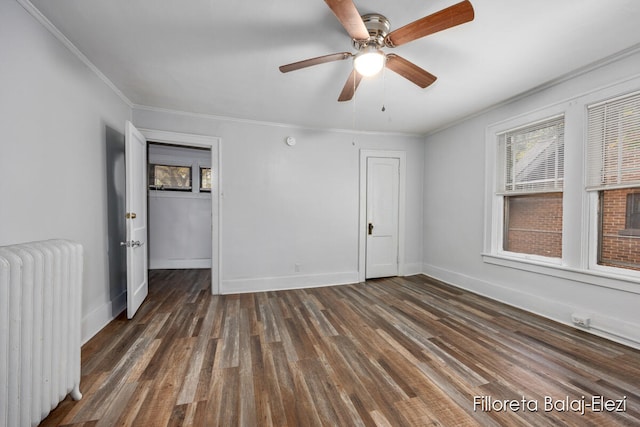 unfurnished bedroom with radiator, ceiling fan, dark hardwood / wood-style flooring, and ornamental molding