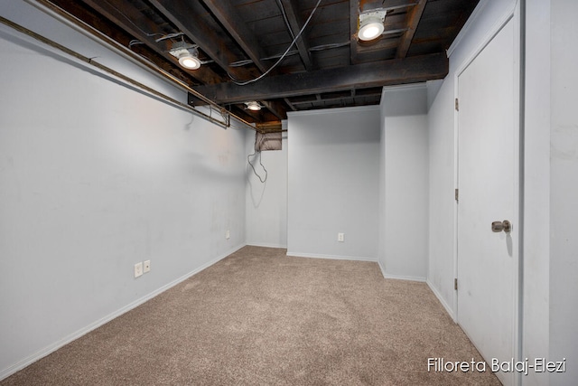 basement featuring carpet flooring