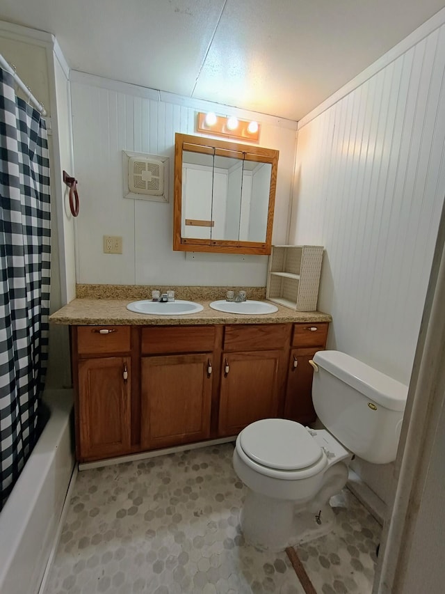 full bathroom featuring vanity, toilet, and shower / bathtub combination with curtain