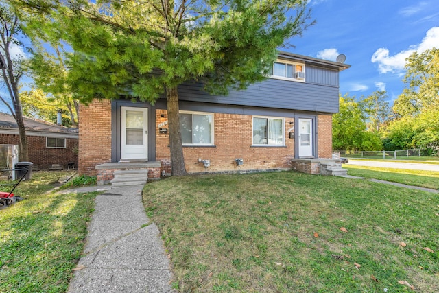 view of front of home with a front lawn