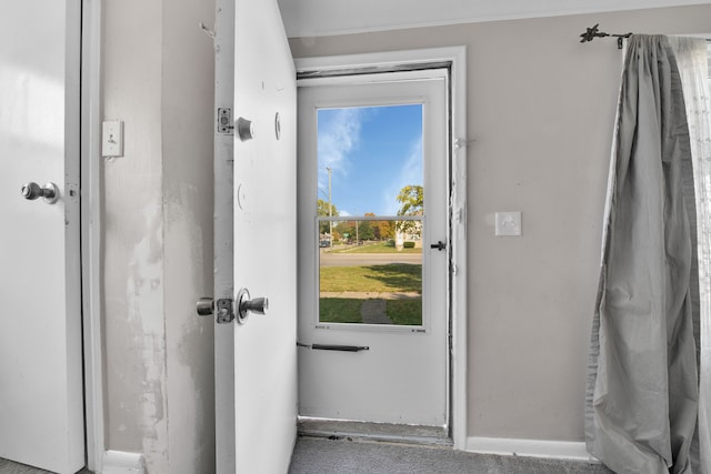 doorway featuring carpet