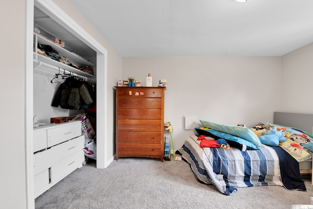 carpeted bedroom featuring a closet