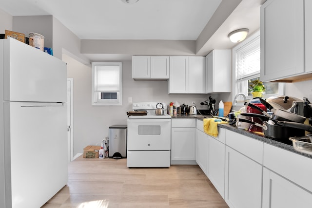 kitchen with white cabinets, white appliances, and light wood-type flooring