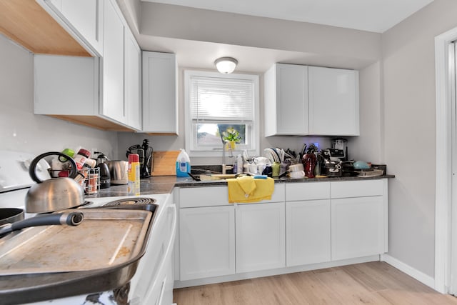 kitchen featuring light hardwood / wood-style flooring and white cabinets