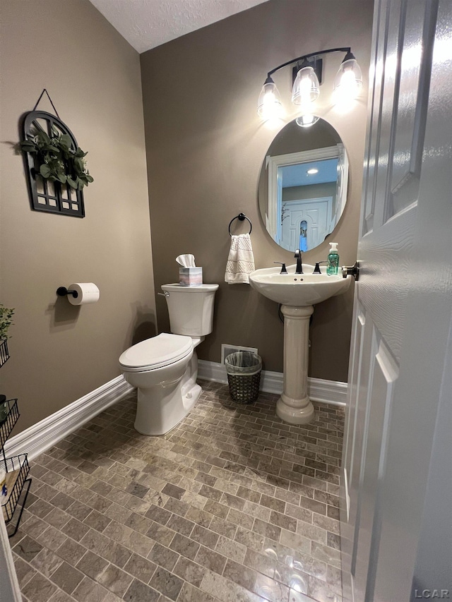 bathroom featuring toilet