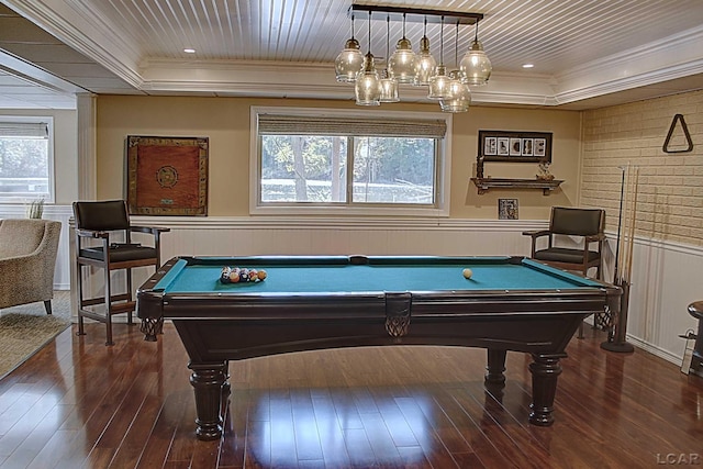 playroom featuring billiards, a tray ceiling, ornamental molding, dark hardwood / wood-style flooring, and wooden ceiling