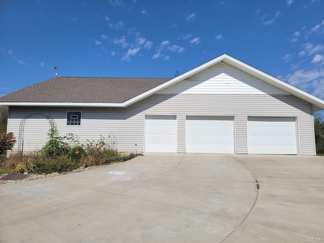 view of side of property with a garage