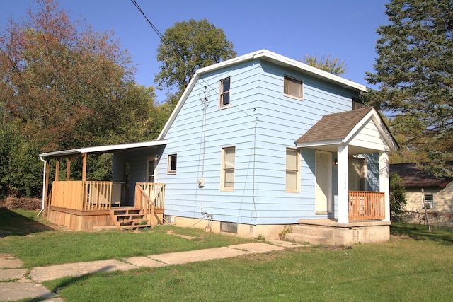 view of front of home with a front lawn and a porch