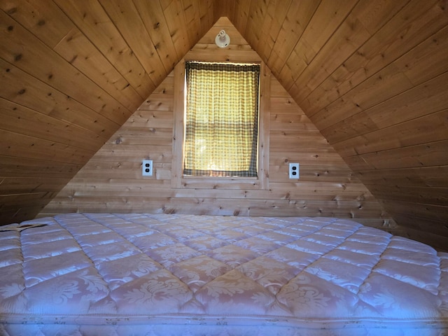 unfurnished bedroom featuring wooden ceiling, wooden walls, and vaulted ceiling