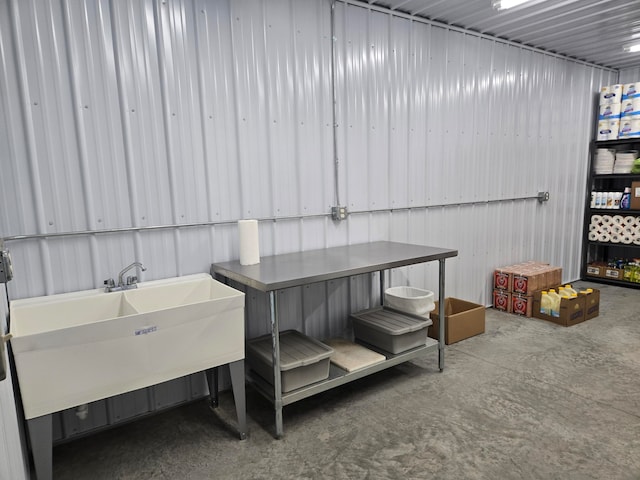 exterior space featuring concrete flooring and sink