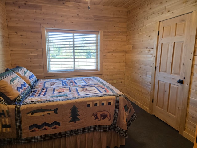 bedroom with wood walls and wood ceiling