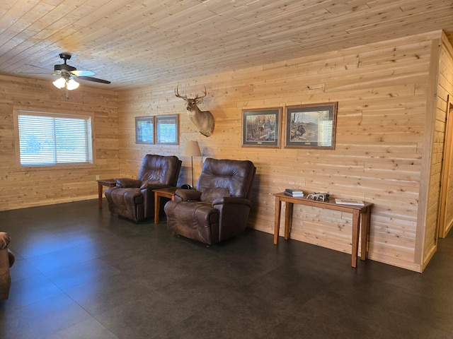 living area featuring wood walls, ceiling fan, and wooden ceiling