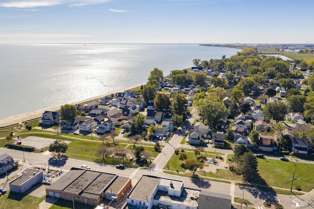 drone / aerial view featuring a residential view and a water view