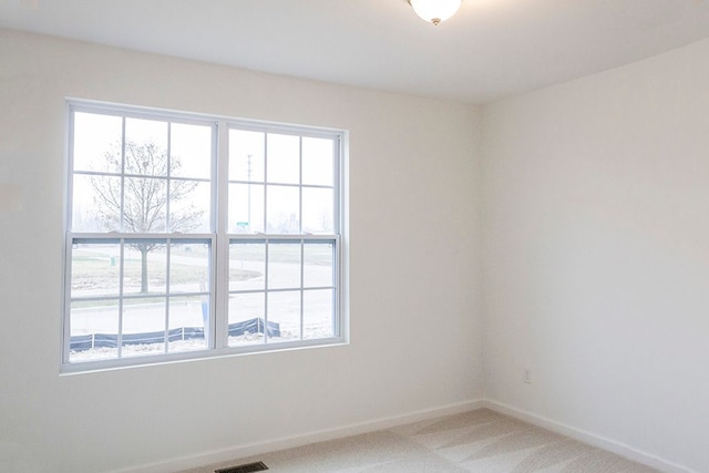 empty room featuring carpet flooring