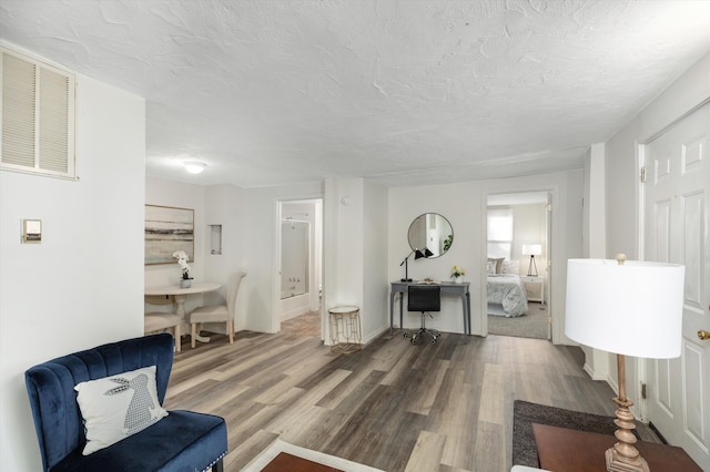 interior space with hardwood / wood-style floors and a textured ceiling