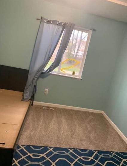 unfurnished bedroom with carpet