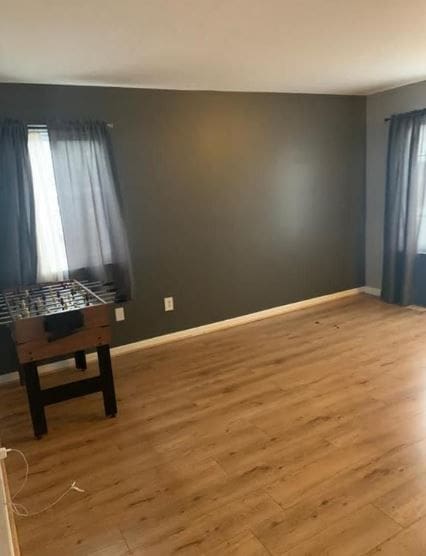 spare room featuring light wood-type flooring