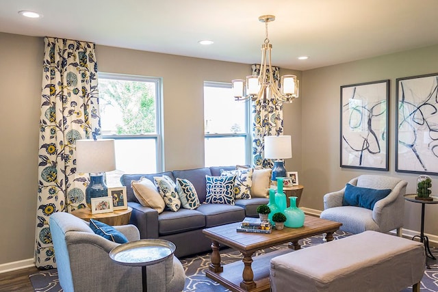 living room featuring a chandelier and dark wood-type flooring