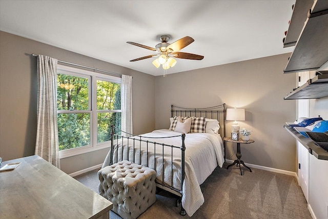 bedroom featuring ceiling fan and dark colored carpet