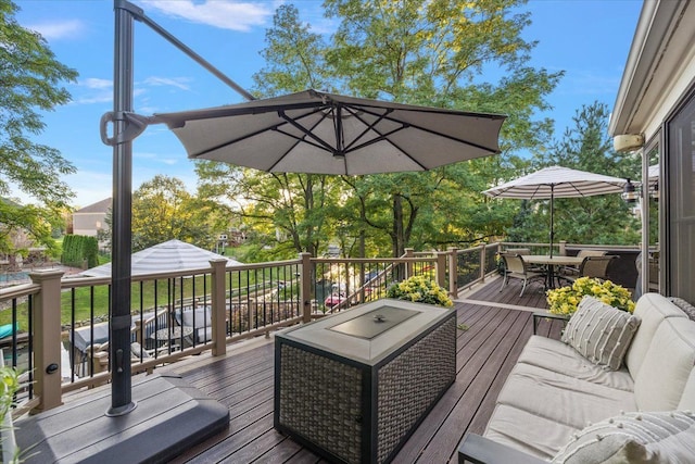 deck featuring an outdoor hangout area and outdoor dining area