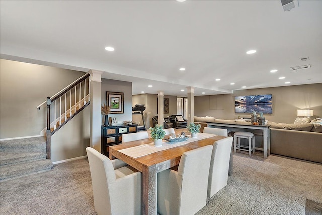 dining area featuring stairway, visible vents, baseboards, recessed lighting, and light carpet