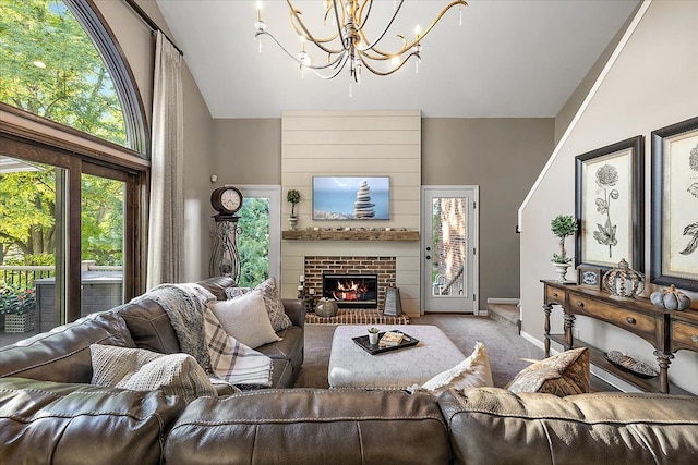 living area featuring baseboards, plenty of natural light, a fireplace, and carpet flooring