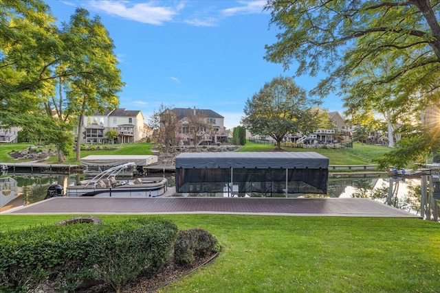 view of home's community with a yard and a boat dock