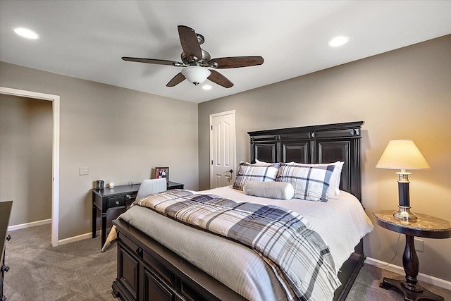 bedroom with dark colored carpet, ceiling fan, and a closet