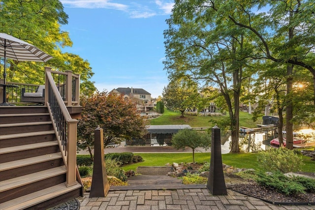 view of yard featuring stairway and a wooden deck