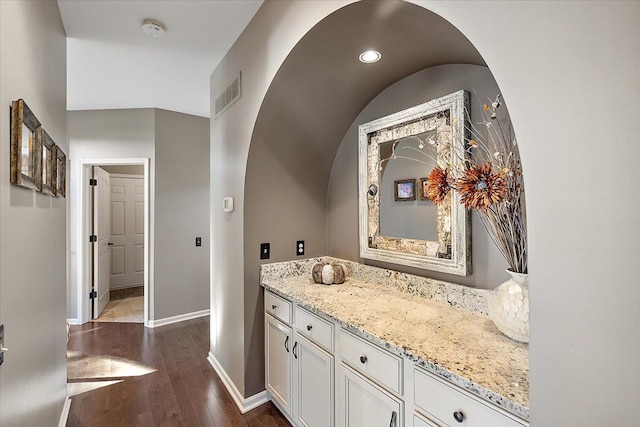 bathroom with vanity and wood-type flooring