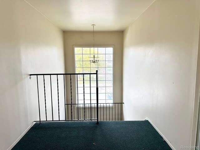 51316 Johns Dr Unit 14, Chesterfield, MI 48047 - unfurnished room featuring carpet flooring, baseboards, and a chandelier