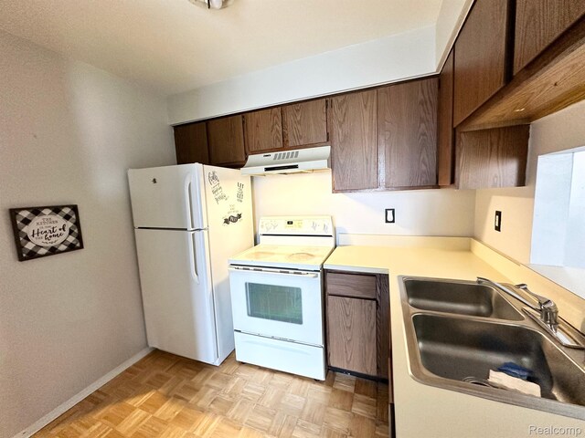 51316 Johns Dr Unit 14, Chesterfield, MI 48047 - kitchen featuring white appliances, under cabinet range hood, a sink, light countertops, and dark brown cabinetry