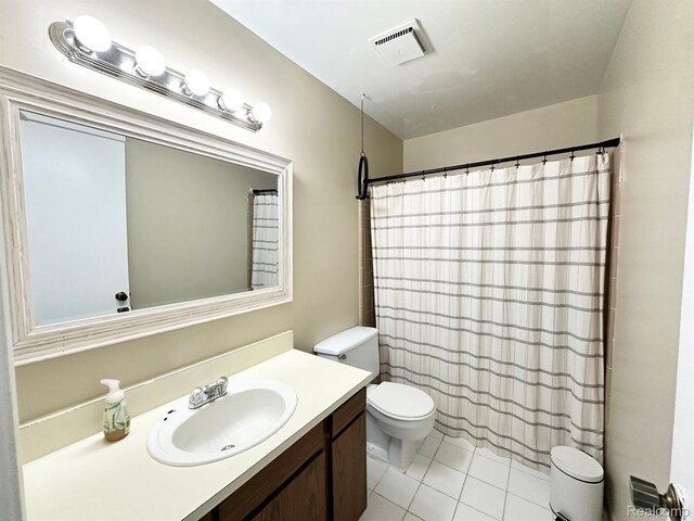 51316 Johns Dr Unit 14, Chesterfield, MI 48047 - bathroom featuring toilet, vanity, tile patterned floors, and a shower with curtain