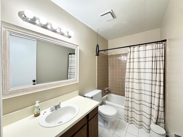 51316 Johns Dr Unit 14, Chesterfield, MI 48047 - bathroom featuring toilet, vanity, shower / bath combo with shower curtain, and tile patterned floors