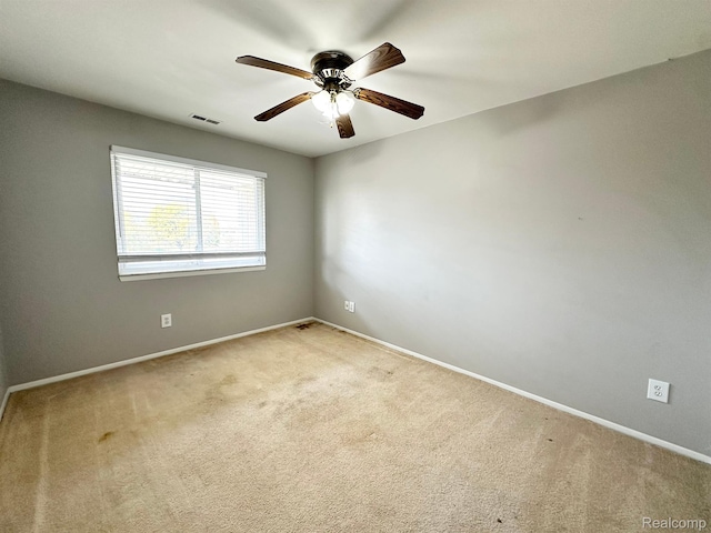 51316 Johns Dr Unit 14, Chesterfield, MI 48047 - unfurnished room with light colored carpet, ceiling fan, and baseboards