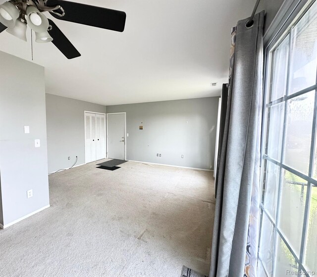 51316 Johns Dr Unit 14, Chesterfield, MI 48047 - carpeted spare room with plenty of natural light, ceiling fan, and baseboards