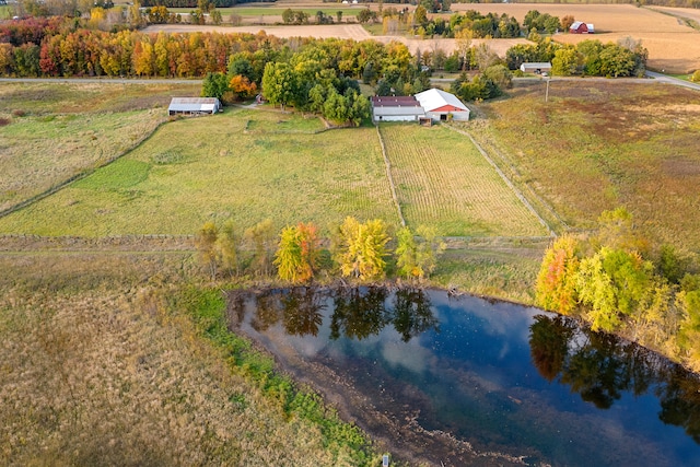 birds eye view of property with a water view and a rural view