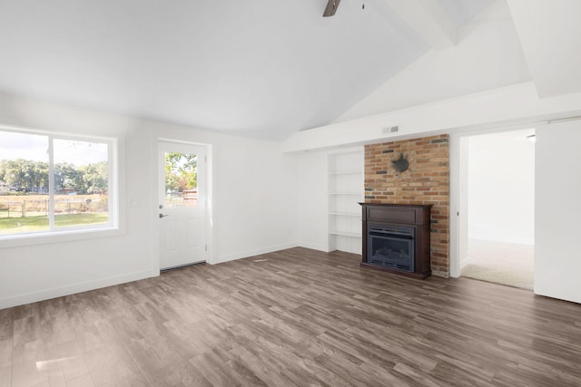 unfurnished living room with ceiling fan, dark hardwood / wood-style flooring, and lofted ceiling