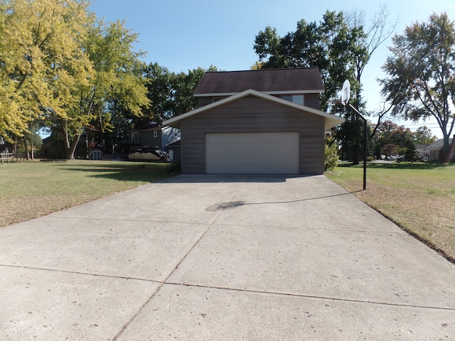 garage featuring a lawn