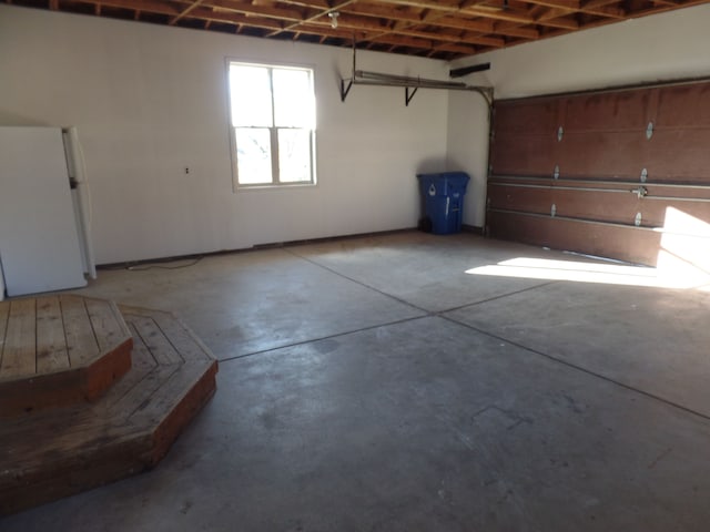 garage with white fridge