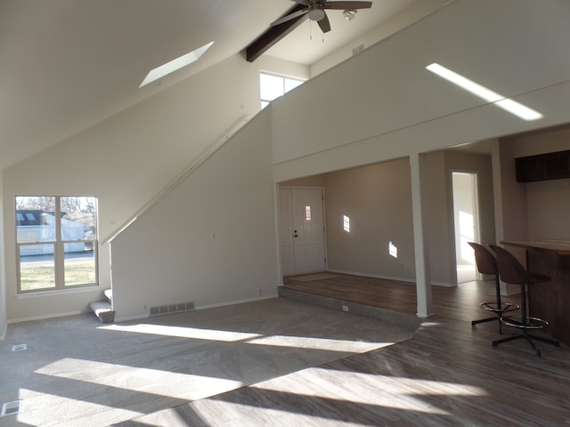 living room featuring high vaulted ceiling, plenty of natural light, and ceiling fan