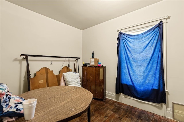 bedroom featuring dark hardwood / wood-style floors