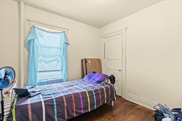 bedroom featuring dark hardwood / wood-style flooring