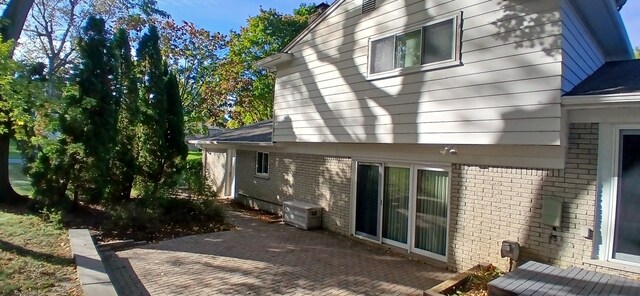 view of home's exterior featuring a patio area